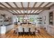 Spacious kitchen and dining area featuring modern appliances, large island, and a view of the backyard at 19054 N 97Th Pl, Scottsdale, AZ 85255
