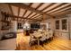 Spacious kitchen featuring exposed wood beams, large island and dining table at 19054 N 97Th Pl, Scottsdale, AZ 85255