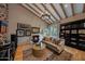 Comfortable living room with vaulted ceilings, exposed beams and modern decor at 19054 N 97Th Pl, Scottsdale, AZ 85255