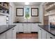 Walk-in pantry with ample storage space, brick floors, and stylish decor at 19054 N 97Th Pl, Scottsdale, AZ 85255