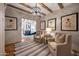 An elegant sitting area with comfortable chairs and stylish decor creates an inviting and cozy space at 19054 N 97Th Pl, Scottsdale, AZ 85255