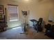 Exercise room equipped with treadmill, elliptical and other fitness equipment at 21013 W Wycliff Dr, Buckeye, AZ 85396