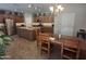Bright kitchen with stainless appliances, granite island, and open dining area at 21013 W Wycliff Dr, Buckeye, AZ 85396