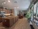 Open-concept kitchen featuring granite countertops, an island, and stainless steel appliances at 21013 W Wycliff Dr, Buckeye, AZ 85396