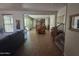 View of the spacious living room showing an open floor plan leading to the kitchen and dining area at 21013 W Wycliff Dr, Buckeye, AZ 85396