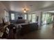 Spacious living room with neutral walls, a ceiling fan, and several windows at 21013 W Wycliff Dr, Buckeye, AZ 85396