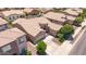 Expansive aerial view showcases the circular entrance, beautiful landscaping and roof design at 21275 E Russet Rd, Queen Creek, AZ 85142