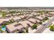 This high-angle view depicts a residential area with diverse homes and green spaces at 21275 E Russet Rd, Queen Creek, AZ 85142