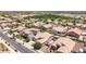An aerial of a neighborhood shows well-maintained homes, landscaping, and community park at 21275 E Russet Rd, Queen Creek, AZ 85142