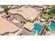 This aerial view features a backyard with a pool, spa, covered patio, and grill at 21275 E Russet Rd, Queen Creek, AZ 85142