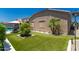 Private backyard features lush greenery and a covered patio with a pool at 21275 E Russet Rd, Queen Creek, AZ 85142