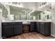 Beautiful bathroom vanity with dual sinks and modern fixtures, wood-look floors and ample lighting at 21275 E Russet Rd, Queen Creek, AZ 85142
