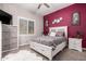 Comfortable bedroom with a ceiling fan and a bright window provides plenty of natural light at 21275 E Russet Rd, Queen Creek, AZ 85142