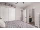Light and airy bedroom with a ceiling fan and sliding door closet features gray walls at 21275 E Russet Rd, Queen Creek, AZ 85142