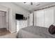 Cozy bedroom featuring a dresser with TV, and a neutral color scheme at 21275 E Russet Rd, Queen Creek, AZ 85142