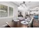 Dining room with seating for six and open view to kitchen at 21275 E Russet Rd, Queen Creek, AZ 85142