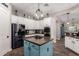 Modern kitchen featuring white cabinetry, granite counters, and stainless appliances at 21275 E Russet Rd, Queen Creek, AZ 85142