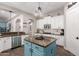 Kitchen with a center island, stainless steel appliances, and white cabinets at 21275 E Russet Rd, Queen Creek, AZ 85142