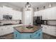 Stylish kitchen with white cabinets, granite counters, and tile backsplash at 21275 E Russet Rd, Queen Creek, AZ 85142
