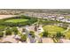 A community aerial view highlights a nearby recreational area with paths and green space at 21275 E Russet Rd, Queen Creek, AZ 85142