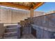 Covered outdoor kitchen with stainless steel grill and stone countertops, ideal for outdoor cooking and entertaining at 21275 E Russet Rd, Queen Creek, AZ 85142