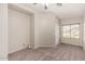 Spacious, carpeted bedroom boasts ceiling fan and window at 22125 N 29Th Ave # 158, Phoenix, AZ 85027