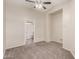 Bedroom boasts neutral carpet, fan, and bathroom access at 22125 N 29Th Ave # 158, Phoenix, AZ 85027