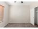 This cozy bedroom features neutral paint, ceiling fan and closet at 22125 N 29Th Ave # 158, Phoenix, AZ 85027