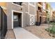 Inviting walkway leads to the townhouse entrance, featuring stone accents and low-maintenance landscaping at 22125 N 29Th Ave # 158, Phoenix, AZ 85027