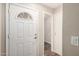 Bright, welcoming front door with decorative glass window and neutral interior hallway at 22125 N 29Th Ave # 158, Phoenix, AZ 85027