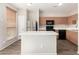 Modern kitchen features an island, stainless steel appliances, and ample counter space for cooking at 22125 N 29Th Ave # 158, Phoenix, AZ 85027