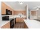 Bright kitchen with wood cabinets, white countertops, and modern appliances at 22125 N 29Th Ave # 158, Phoenix, AZ 85027