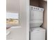 This stacked washer and dryer laundry area offers convenience and space-saving design at 22125 N 29Th Ave # 158, Phoenix, AZ 85027