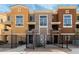 Charming townhouse exterior showcasing a gated entrance and colorful facade, offering inviting curb appeal at 22125 N 29Th Ave # 158, Phoenix, AZ 85027