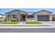 Charming single-story home with a covered porch, three-car garage, and well-maintained landscaping at 3118 E Gary Way, Phoenix, AZ 85042