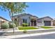 Charming single-story home with manicured lawn, stone accents, and inviting front porch at 3118 E Gary Way, Phoenix, AZ 85042