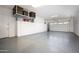 Spacious garage with epoxy floors, custom storage cabinets, and overhead storage rack at 3118 E Gary Way, Phoenix, AZ 85042