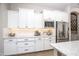 Well-equipped kitchen featuring white cabinetry, stainless steel appliances, and granite countertops with backsplash at 3118 E Gary Way, Phoenix, AZ 85042
