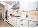 Modern kitchen features white cabinets, subway tile backsplash, and stainless steel appliances at 3118 E Gary Way, Phoenix, AZ 85042