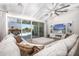 Comfortable living room with a large sectional sofa, a TV, and sliding glass doors to the backyard at 3118 E Gary Way, Phoenix, AZ 85042