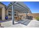 Backyard patio with a pergola, built-in barbecue, a grill, and a wooden picnic table at 3118 E Gary Way, Phoenix, AZ 85042