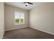 Comfortable bedroom with carpet, neutral walls, and plantation shutters allowing plenty of natural light at 31409 N 58Th Pl, Cave Creek, AZ 85331