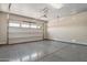 Clean and spacious garage with epoxy flooring, providing ample parking and storage at 31409 N 58Th Pl, Cave Creek, AZ 85331
