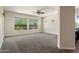 Spacious main bedroom with carpet flooring, ceiling fan and multiple windows allowing plenty of natural light at 31409 N 58Th Pl, Cave Creek, AZ 85331