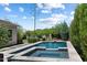 Stunning backyard pool with lush greenery, perfect for outdoor relaxation and entertainment at 31409 N 58Th Pl, Cave Creek, AZ 85331