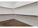 Walk-in closet features carpet floors and wood shelving, providing ample storage space at 31409 N 58Th Pl, Cave Creek, AZ 85331