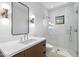 Modern bathroom showcasing a glass-enclosed shower, contemporary vanity, and stylish fixtures at 325 W Solano Dr, Phoenix, AZ 85013