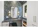 Charming vanity area featuring custom wallpaper and well lit mirror at 325 W Solano Dr, Phoenix, AZ 85013