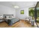 Comfortable bedroom with natural light, hardwood floors, and a relaxing ambiance at 325 W Solano Dr, Phoenix, AZ 85013