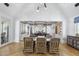 Open-concept dining room featuring high ceilings, stylish lighting, and views into the gourmet kitchen at 325 W Solano Dr, Phoenix, AZ 85013